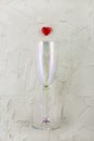 champagne glass with red heart on white background.. Valentine's Day concept Royalty Free Stock Photo