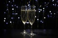 Champagne glasses against dark background with blurred lights Royalty Free Stock Photo