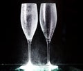 Champagne glasses on black spray Royalty Free Stock Photo