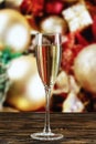champagne in glasses and in a bottle on the background of toys on the Christmas tree. Royalty Free Stock Photo