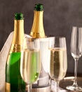 Champagne glasses and bottle on dark background. Royalty Free Stock Photo