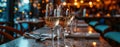 champagne glasses over water in restaurant setting