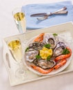 Champagne glasses, oysters shell with shrimp on serving tray