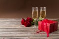 Champagne glasses, red gift box and red roses Royalty Free Stock Photo