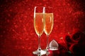 Champagne glasses with roses and rings Royalty Free Stock Photo