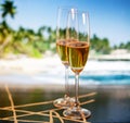 Champagne glasses on tropical beach - exotic New Year Royalty Free Stock Photo