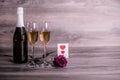 Champagne, rose and a lovely message on the table Royalty Free Stock Photo