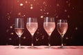 Champagne or rose wine in many elegant glasses on festive pink background.