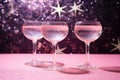 Champagne or rose wine in many elegant glasses on festive pink background. Royalty Free Stock Photo