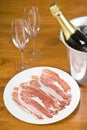 Champagne and Spanish Cured Ham Royalty Free Stock Photo