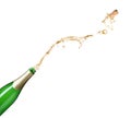 Champagne splashing out of bottle on background