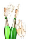 Champagne splashing out of bottles and glasses on background