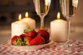 Champagne, strawberries and candles.