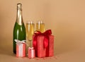 Champagne, wine glasses, boxes of gifts decorated with bow, on b Royalty Free Stock Photo