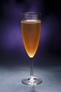 Champaign glass in front of purple background Royalty Free Stock Photo