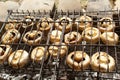Champignon mushrooms are grilled. Fry mushrooms on a homemade stone grill. Royalty Free Stock Photo