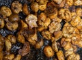 Champignons fried delicious aromatic in a frying pan close-up, shiny from butter seasoned Royalty Free Stock Photo