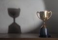 Champion golden trophy placed on wooden table Royalty Free Stock Photo