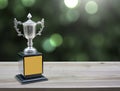 Champion silver trophies on wood table Royalty Free Stock Photo