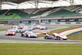 Champion Team Weider leads the pack into turn 2