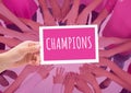 Champions Text on card in circle of hands together for breast cancer awareness Royalty Free Stock Photo
