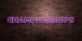 CHAMPIONSHIPS - fluorescent Neon tube Sign on brickwork - Front view - 3D rendered royalty free stock picture