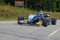 Young woman driver drives her formula 3 during uphill car race in Chamrousse