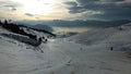 Chamrousse, France, a ski slope with thin snow cover and soil in january 2017