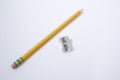 Chancellery, pencil and a sharpener in a white background Royalty Free Stock Photo