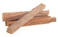 Chandan or sandalwood. Pile of sandalwood sticks isolated on a white background Royalty Free Stock Photo