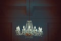 Chandelier in ambient light. Beautiful New Year decor classic home interior