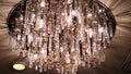 Chandelier in the apartment. Scene. A beautiful chandelier on the ceiling of the apartment. elegant chandelier on the Royalty Free Stock Photo