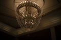 The chandelier on the ceiling. Antique chandelier in the Great Hall. Vintage interior Royalty Free Stock Photo