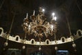 Chandelier with frescoes on walls and Iconostasis