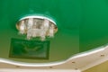 Chandelier on a green ceiling.