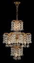 Chandelier for interior of the living room. chandelier decorated with crystals isolated on black background. Royalty Free Stock Photo