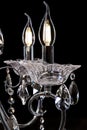 Chandelier for interior of the living room. Large silver crystal chandelier isolated on black background Royalty Free Stock Photo