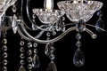 Chandelier for interior of the living room. Large silver crystal chandelier isolated on black background Royalty Free Stock Photo