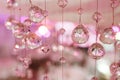 Chandelier light in interior, Chrystals close-up. crystal part from chandelier. Pink colors