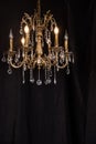 Chandelier, luxury retro style on dark background. Royalty Free Stock Photo