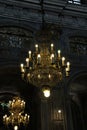 A chandelier made of lights and crystals, candles-shaped lamps