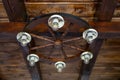 chandelier made from a wooden wagon wheel, rustic bowls and light bulbs, soft focus Royalty Free Stock Photo