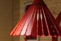 Chandeliers made of red lacquered wood panels