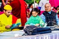 Chandigarh, India - December 4, 2019: A little girl holding papers and helping a volunteer in blood donation camp