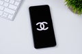 Chanel Fashion app logo on a smartphone screen.