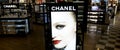 Chanel light banner in shop at duty free cosmetics boutiques at the International Airport at Charles de Gaulle, Paris. Luxury