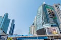 Chang glass buildings in Bangkok city with BTS skytrain foreground and blue sky background showing its design and traffic. Bangkok