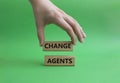 Change agents symbol. Concept word Change agents on wooden blocks. Beautiful green background. Businessman hand. Business and Royalty Free Stock Photo