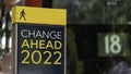 Change Ahead 2022 sign in a busy commuter city center Royalty Free Stock Photo