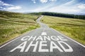 Change ahead sign on the road disappearing into the distance Royalty Free Stock Photo